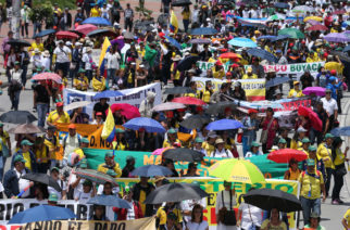 Striking teachers protest a preliminary agreement between the teachers' union and the government, regarding working conditions, during a march in Bogota, Colombia, Wednesday, May 6, 2015. Teachers want a 16% raise, but the agreement includes a 12% increase. Teachers also disagree with obligatory annual evaluations, which would determine pay raises. Currently, exams are taken by teachers specializing in an area, which determines any salary increases, but they are voluntary. (AP Photo/Fernando Vergar