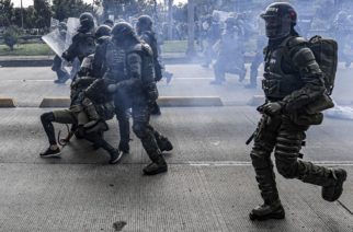 EDITORS NOTE: Graphic content / Riot police arrest a demonstrator during a nationwide strike called by students, unions and indigenous groups to protest against the government of Colombia's President Ivan Duque, in Bogota, on November 21, 2019. (Photo by Juan BARRETO / AFP)